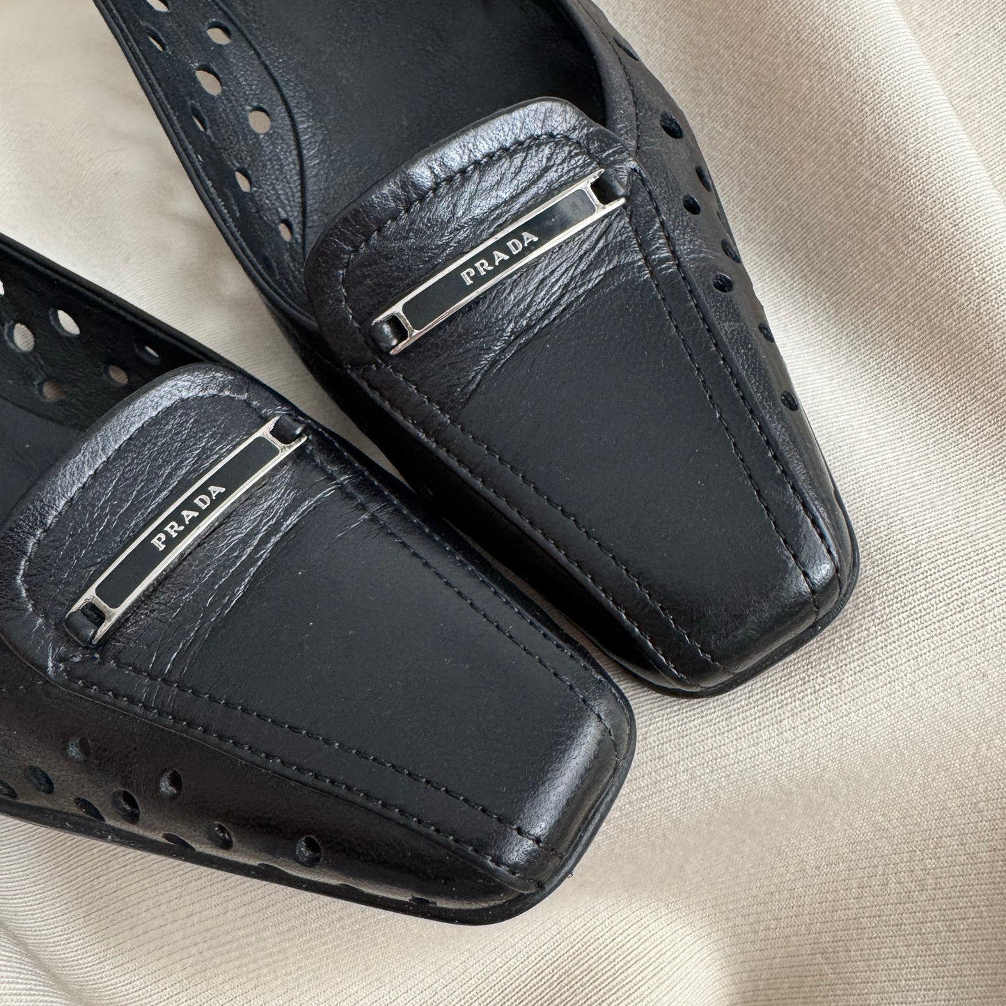 Prada Perforated Leather Kitten Heel Pumps in Black, size 35