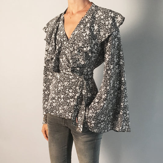 Co Floral Silk Wrap Top with Flared Sleeves in Black/Cream, size Small