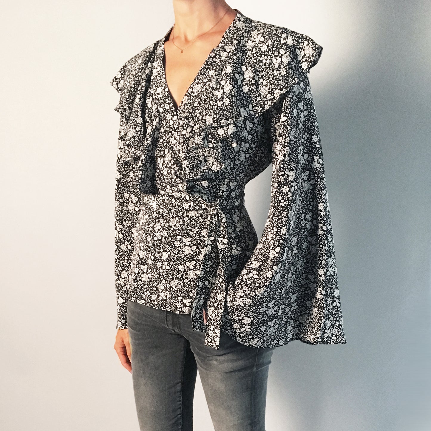 Co Floral Silk Wrap Top with Flared Sleeves in Black/Cream, size Small