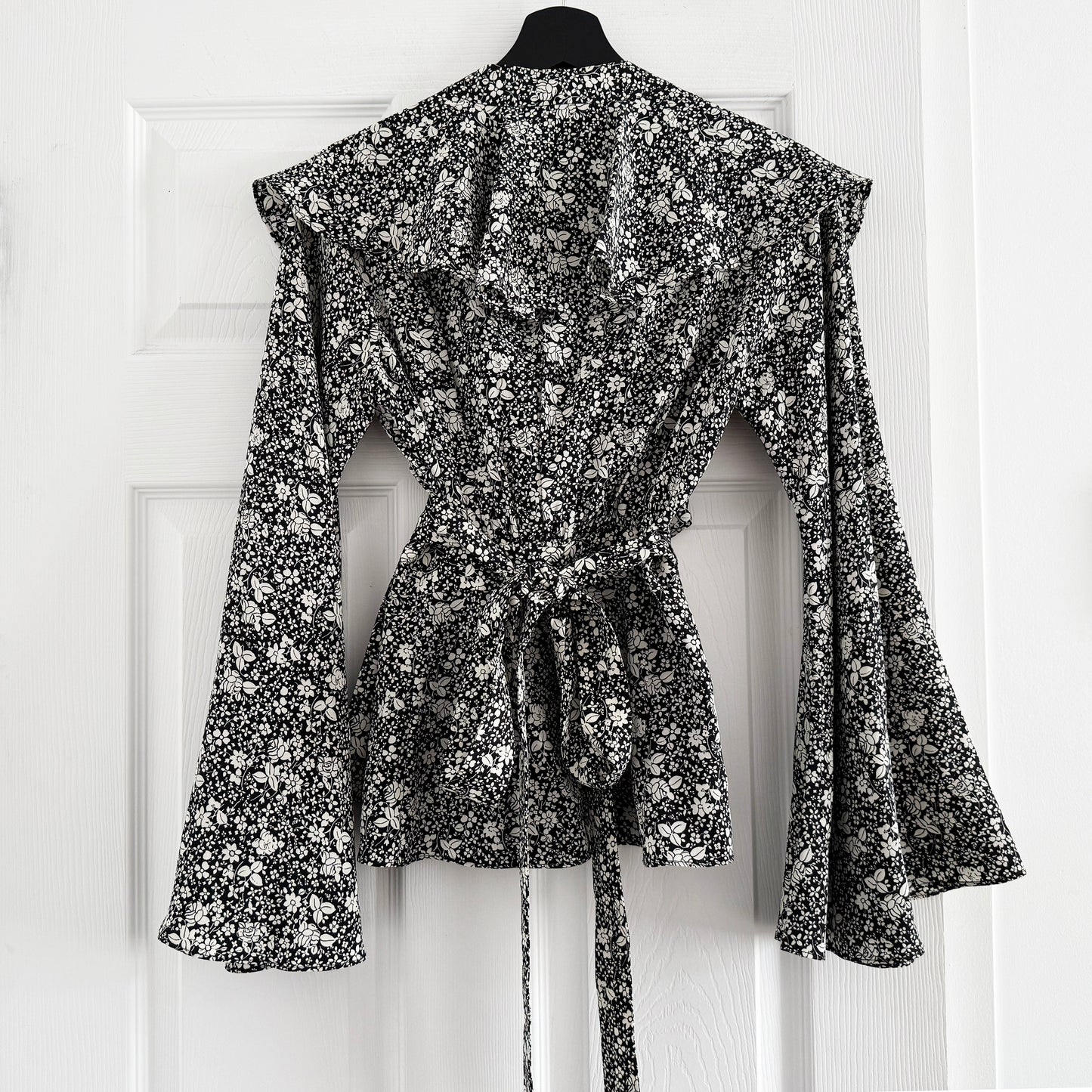 Co Floral Silk Wrap Top with Flared Sleeves in Black/Cream, size Small