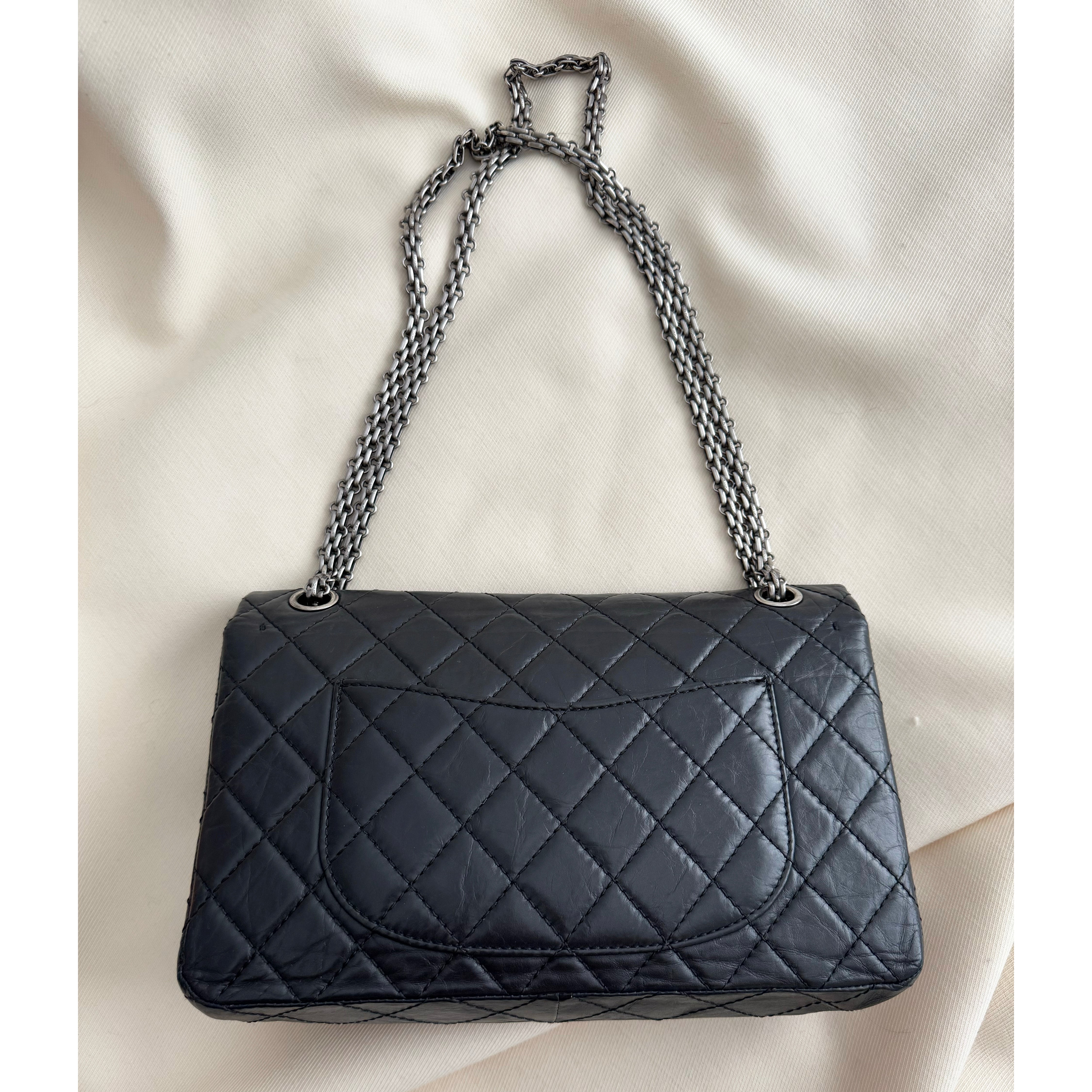 Chanel Black Aged Calfskin Leather Re-issue 2.55 Bag – The Sequel Sale