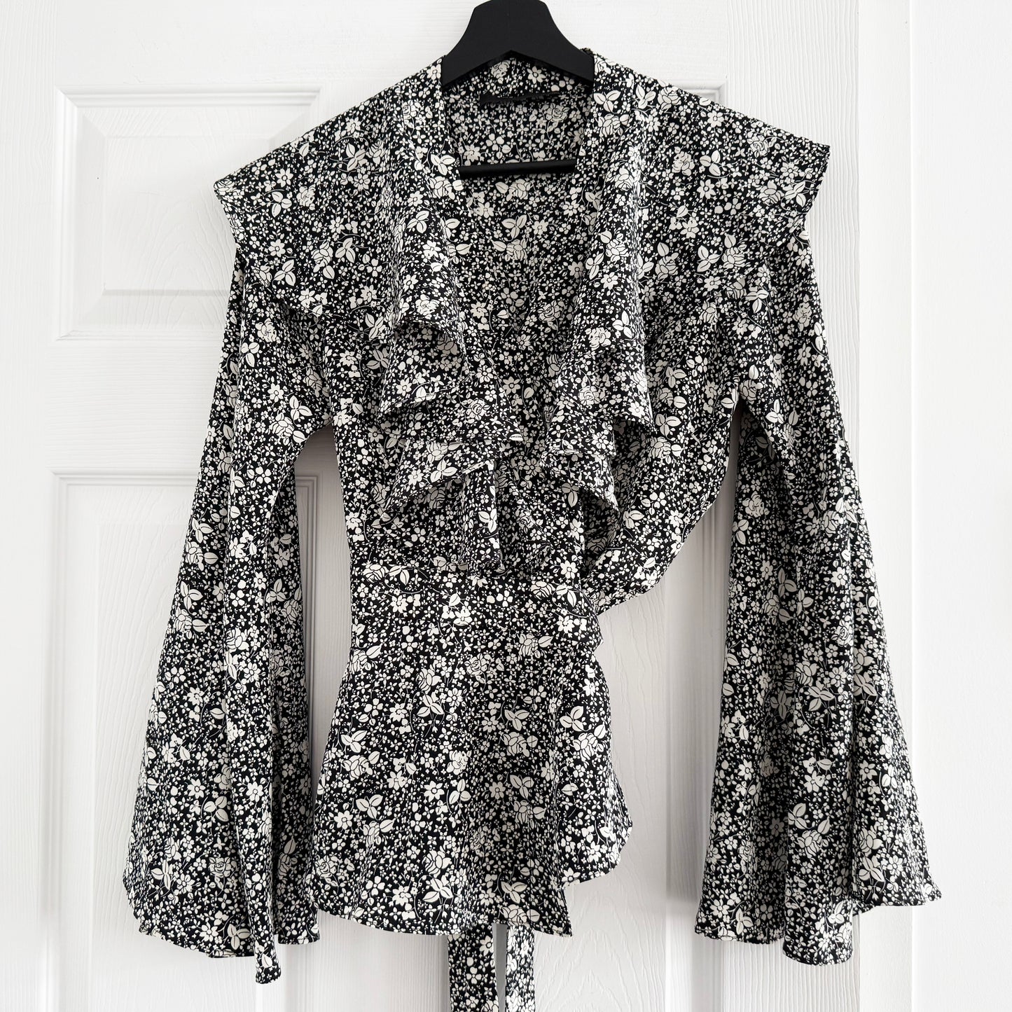 Co Floral Silk Wrap Top with Flared Sleeves in Black/Cream, size Small