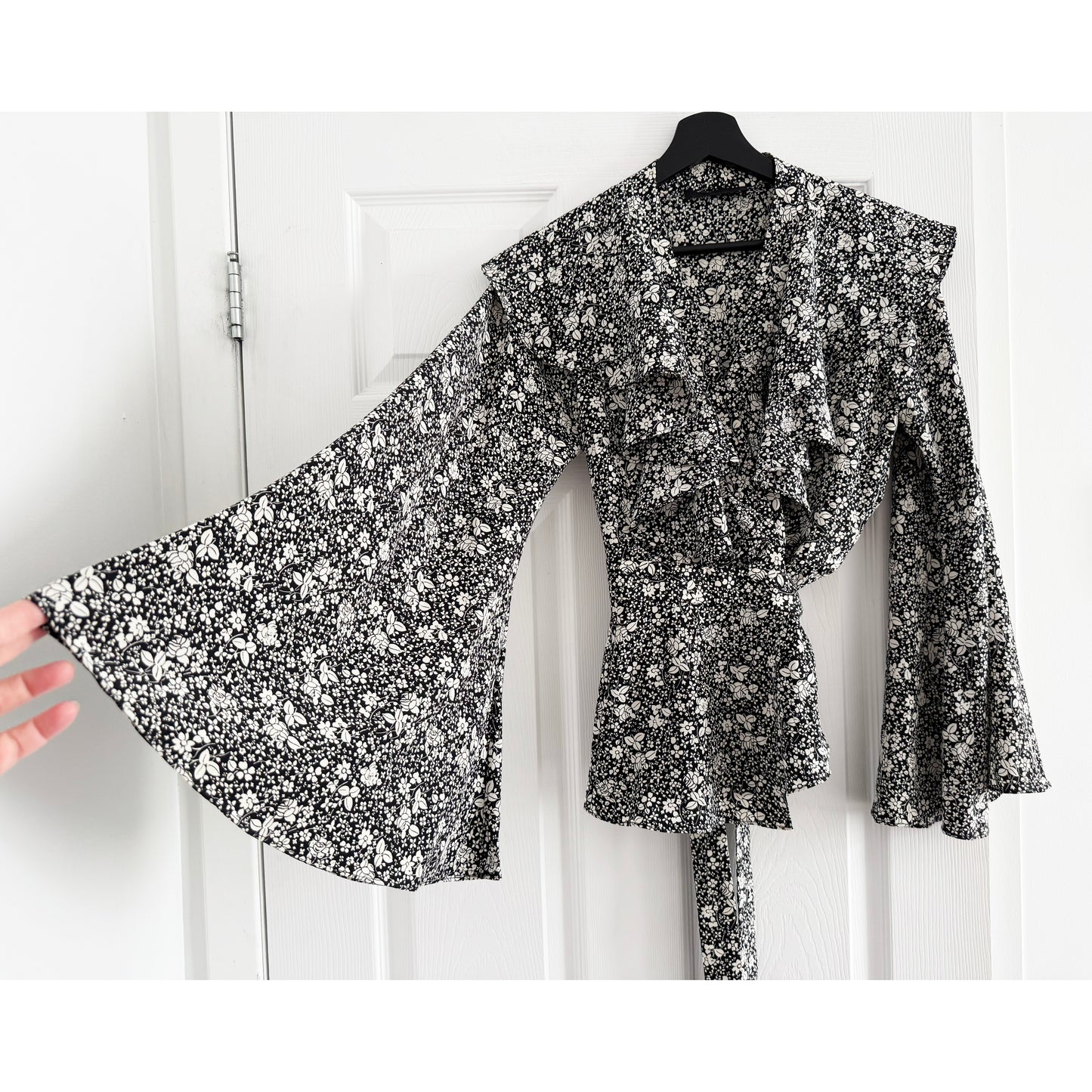 Co Floral Silk Wrap Top with Flared Sleeves in Black/Cream, size Small