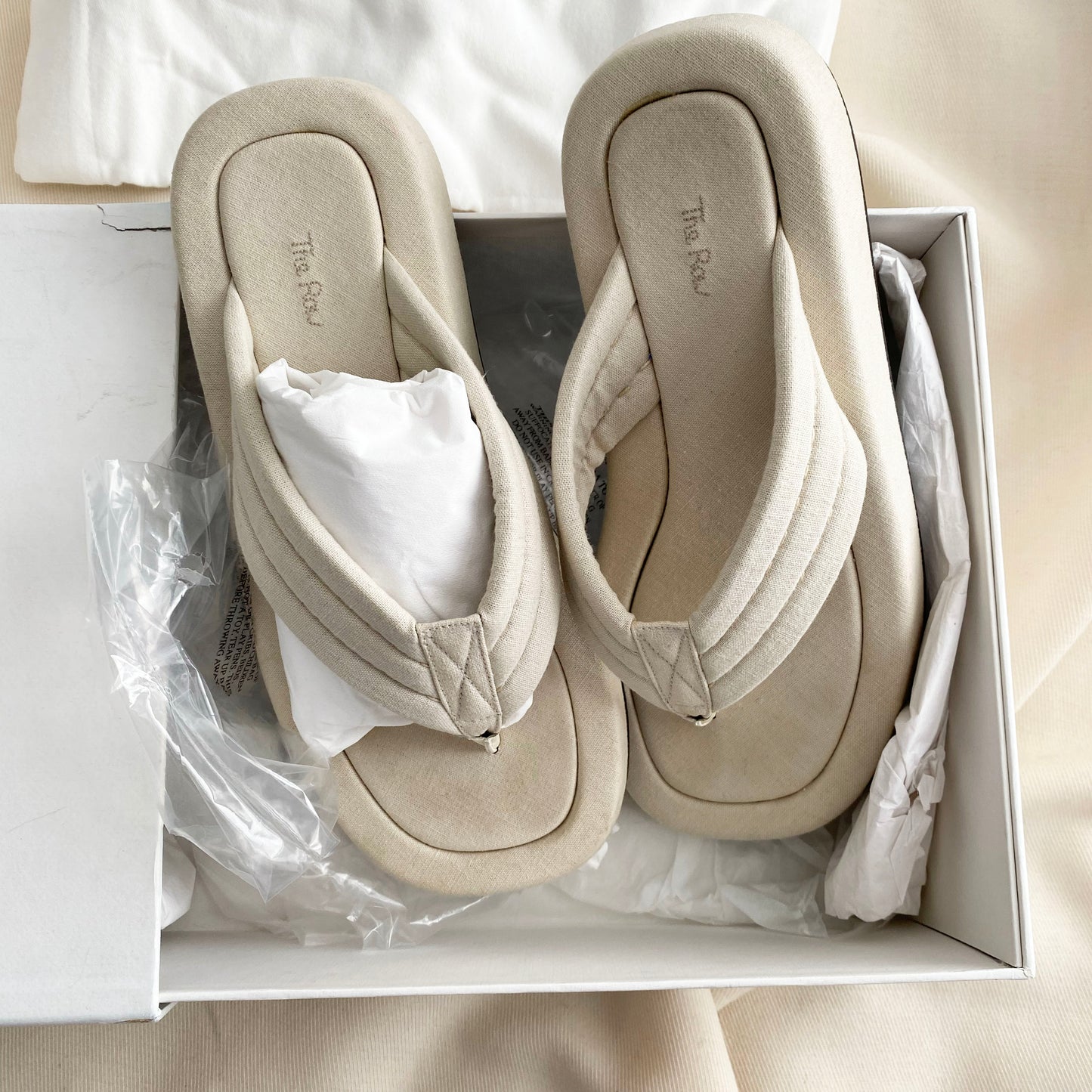 The Row "Ginza" Slides in Ivory Canvas, size 39