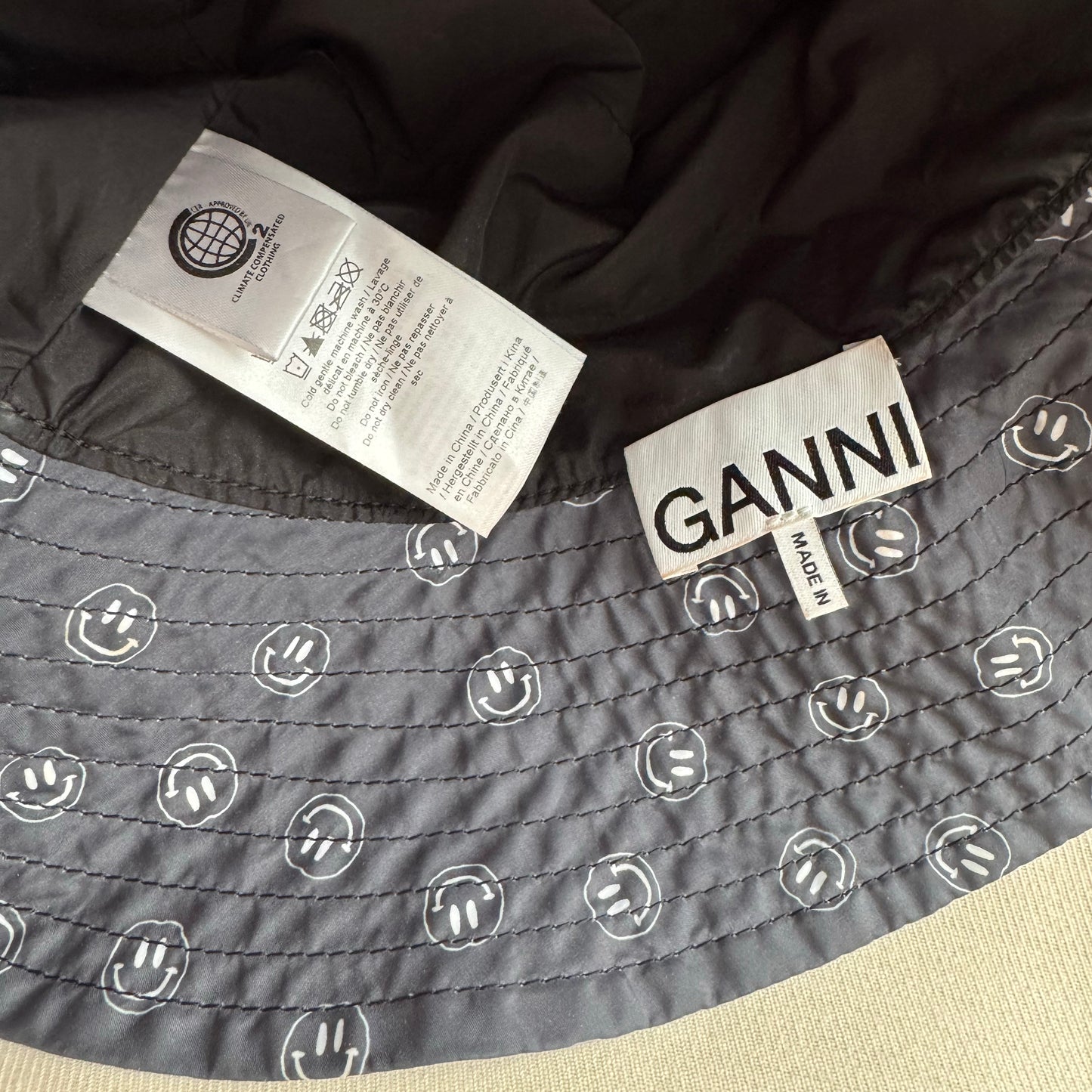 Ganni Printed Bucket Hat in "Phantom", size XS/S