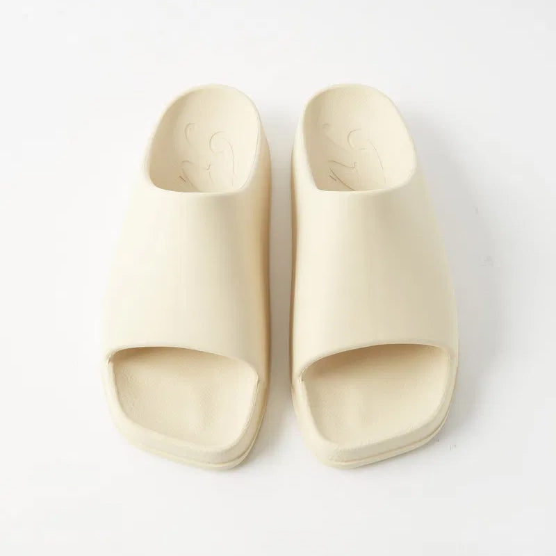 Khaite "Brighton" Rubber Slides in Ivory, size 39