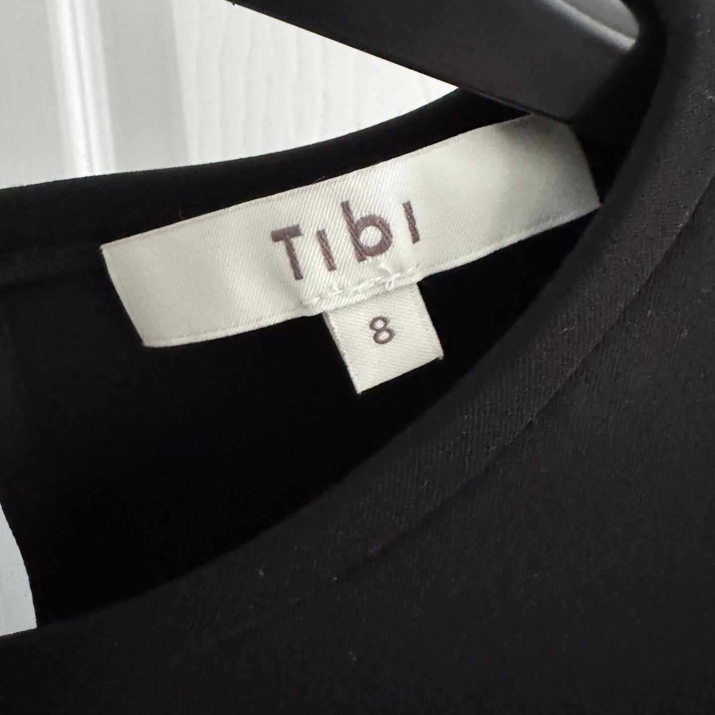 Tibi Compact Ultra Stretch Half Moon Cutout Sleeve Top in Black, size 8